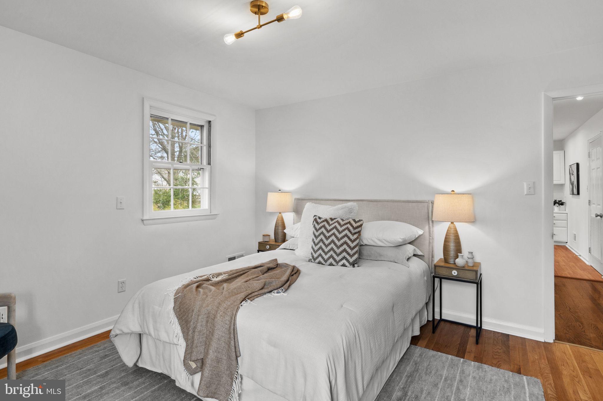 2529 Raven Road Wilmington, DE 19810 - Photo 39 of 80 a bedroom with a bed and wooden floor