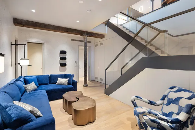 a living room with furniture and a rug