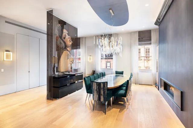 a kitchen with stainless steel appliances kitchen island granite countertop a sink and a stove