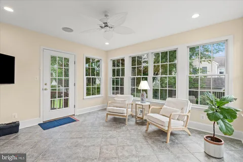 a living room with furniture and windows
