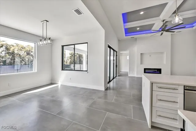 a view of a hallway with chandelier