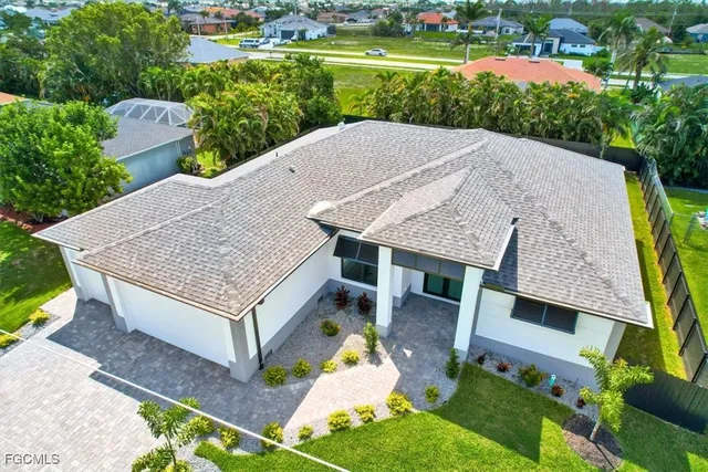 an aerial view of a house having yard and a patio