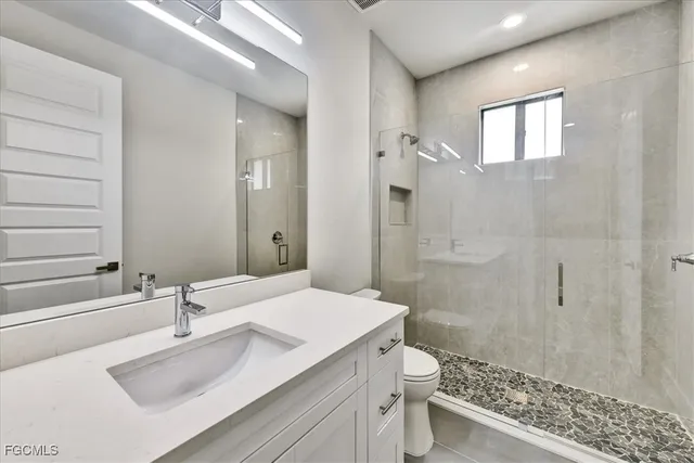 a view of a house with potted plants