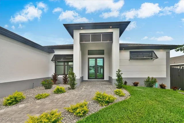 a front view of a house with a yard