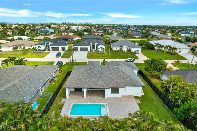 an aerial view of a house with a garden