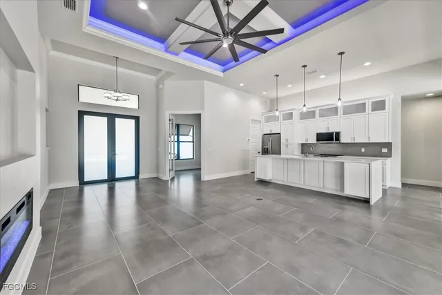 a view of a kitchen with a sink and cabinet