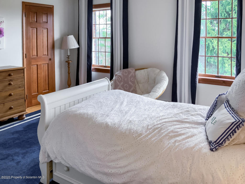 715 Lantern Hill Road Shavertown, PA 18708 - Photo 27 of 38 a large bed sitting in a bedroom next to a window