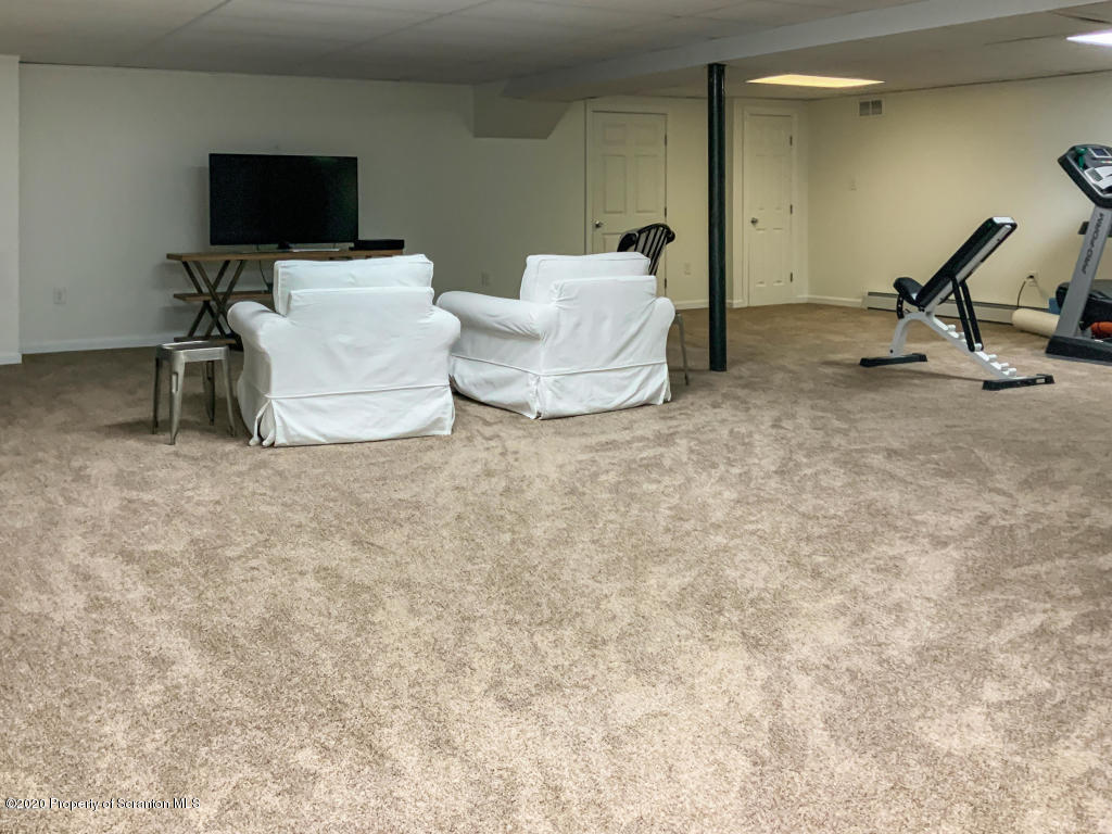 715 Lantern Hill Road Shavertown, PA 18708 - Photo 31 of 38 a living room with furniture and a flat screen tv