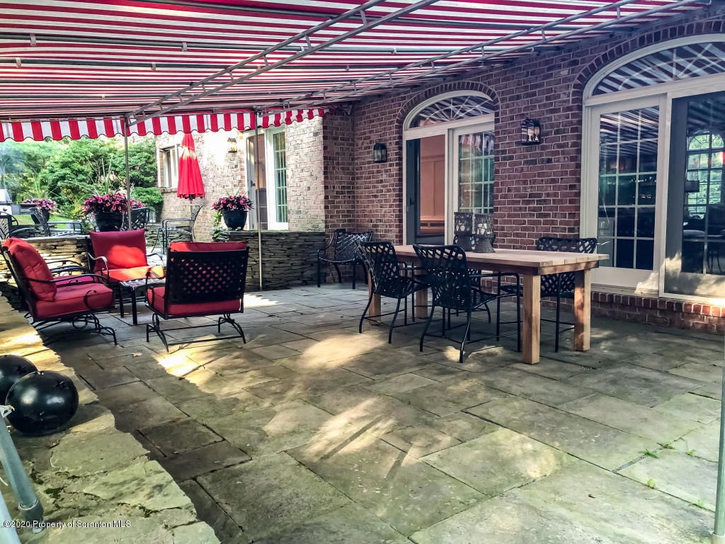 715 Lantern Hill Road Shavertown, PA 18708 - Photo 35 of 38 a view of a dinning tables and chairs in a patio
