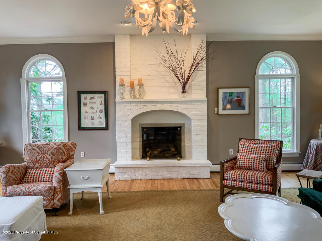 715 Lantern Hill Road Shavertown, PA 18708 - Photo 7 of 38 a living room with furniture and a fireplace