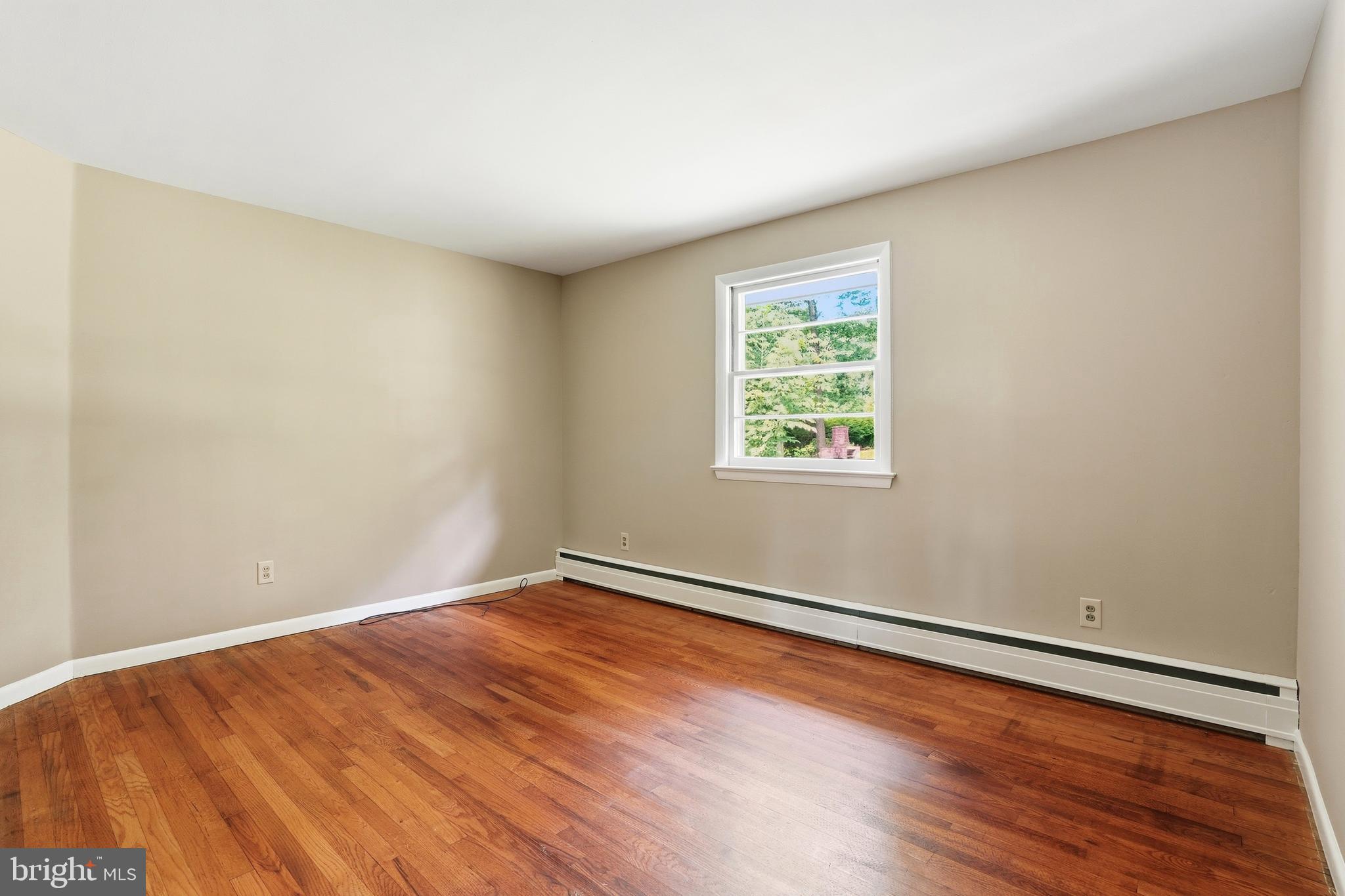 486 Derstine Road Hatfield, PA 19440 - Photo 19 of 53 an empty room with wooden floor and windows