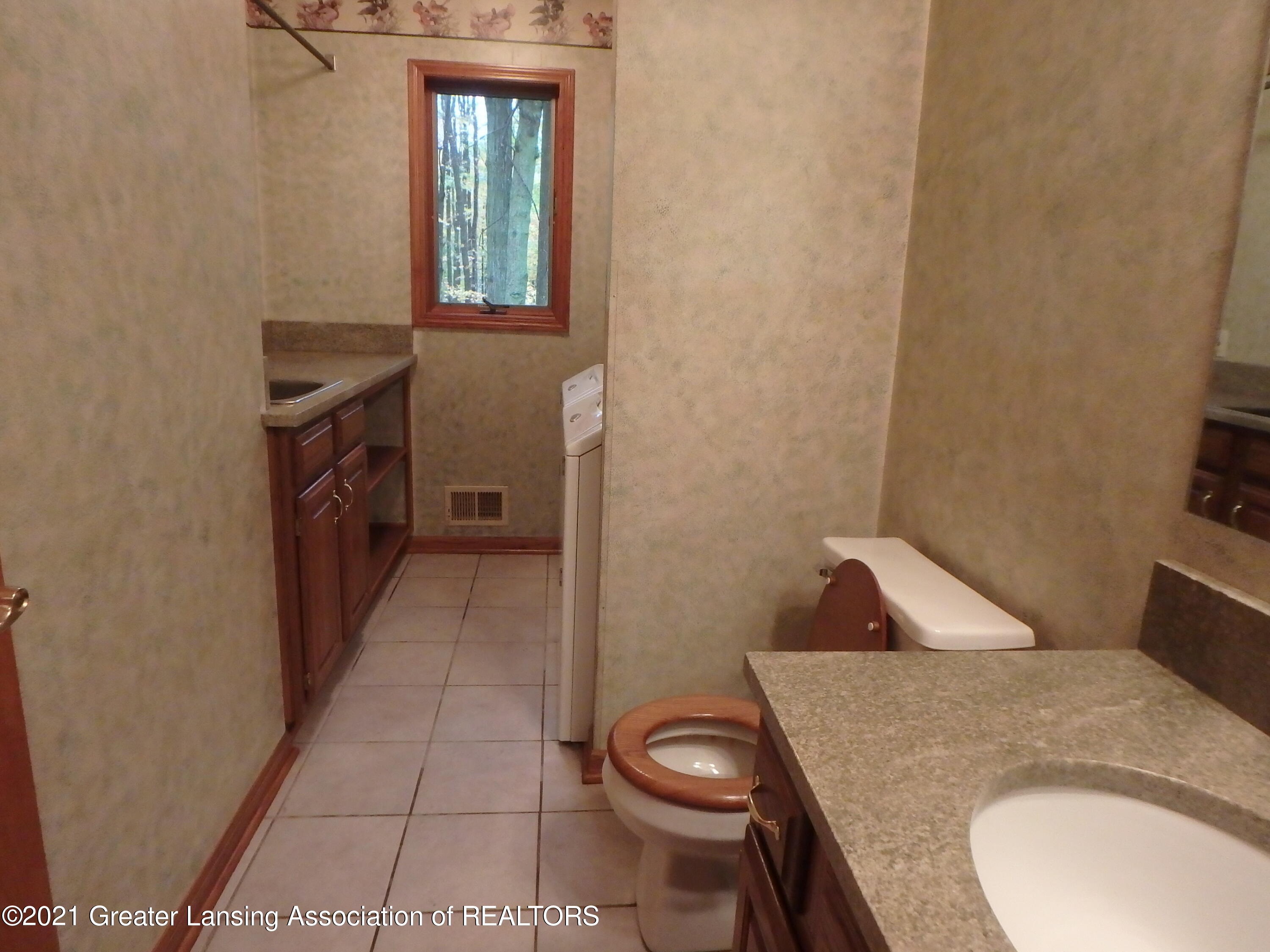 2565 Narrow Lake Road Charlotte, MI 48813 - Photo 31 of 63 half bath with laundry room