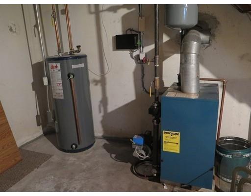 18 Mary Coburn Road Springfield, MA 01129 - Photo 21 of 25 a view of a server room with water heater and wooden floor