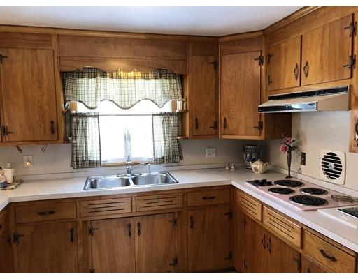 18 Mary Coburn Road Springfield, MA 01129 - Photo 4 of 25 a kitchen with stainless steel appliances a sink a stove and a window