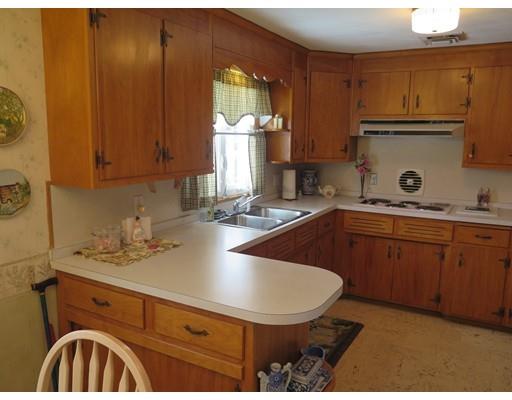 18 Mary Coburn Road Springfield, MA 01129 - Photo 7 of 25 a kitchen with a sink a stove and cabinets