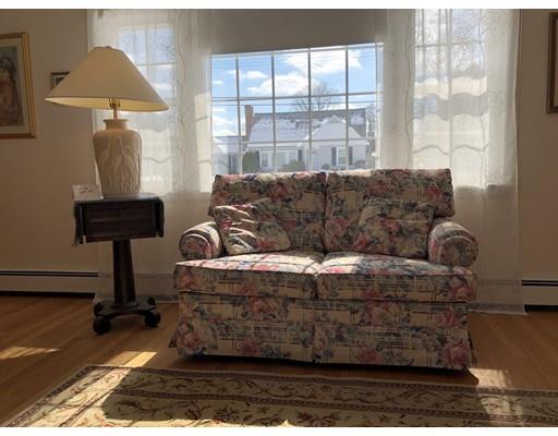 18 Mary Coburn Road Springfield, MA 01129 - Photo 9 of 25 a living room with furniture a lamp and a window