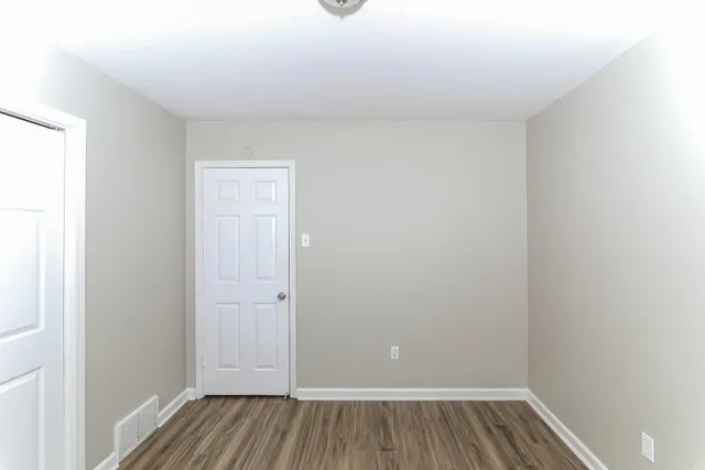 a view of room with hardwood floor