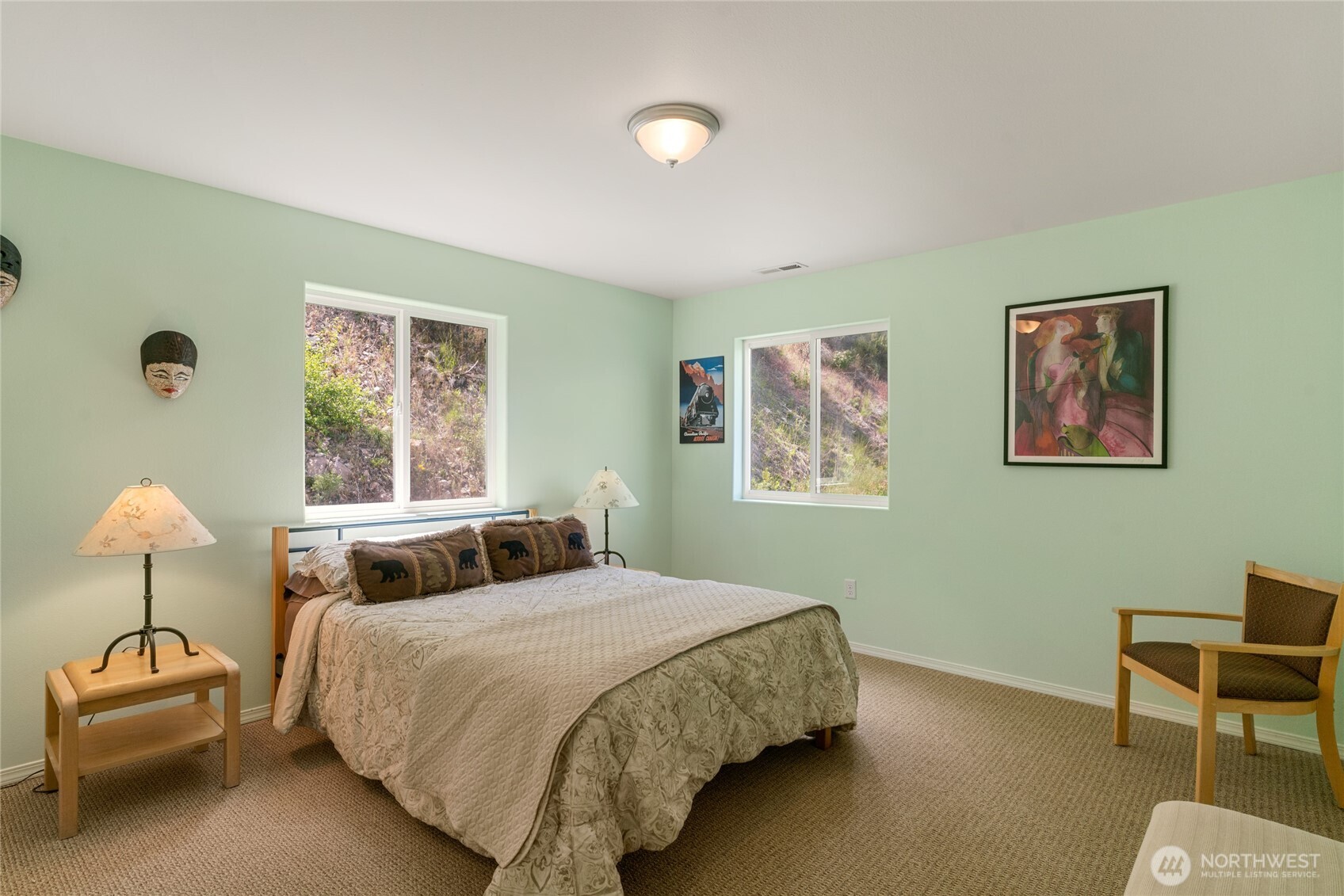 165 Granite Falls Road Chelan, WA 98816 - Photo 17 of 27 a bedroom with a bed and a lamp