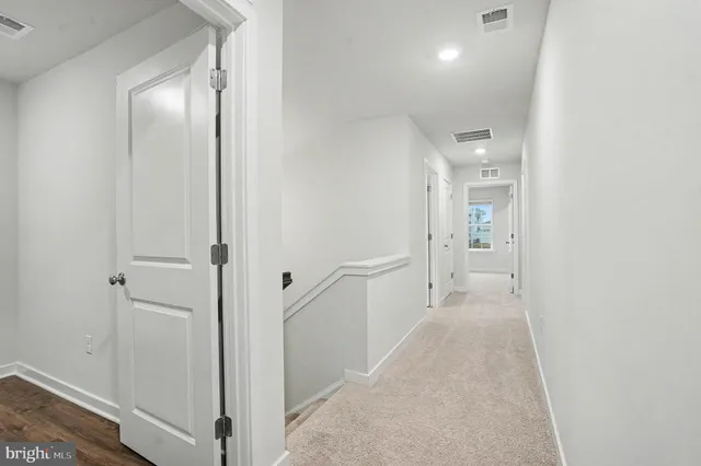 a view of a hallway with a room