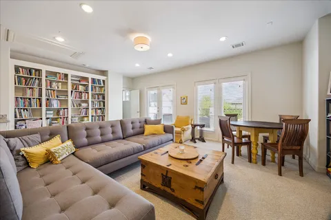 a living room with furniture and a table