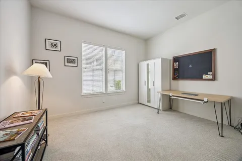 a room with furniture and a flat screen tv