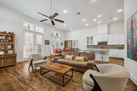 a living room with furniture and kitchen view