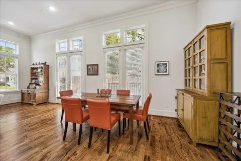 a view of a dining room with furniture and a window