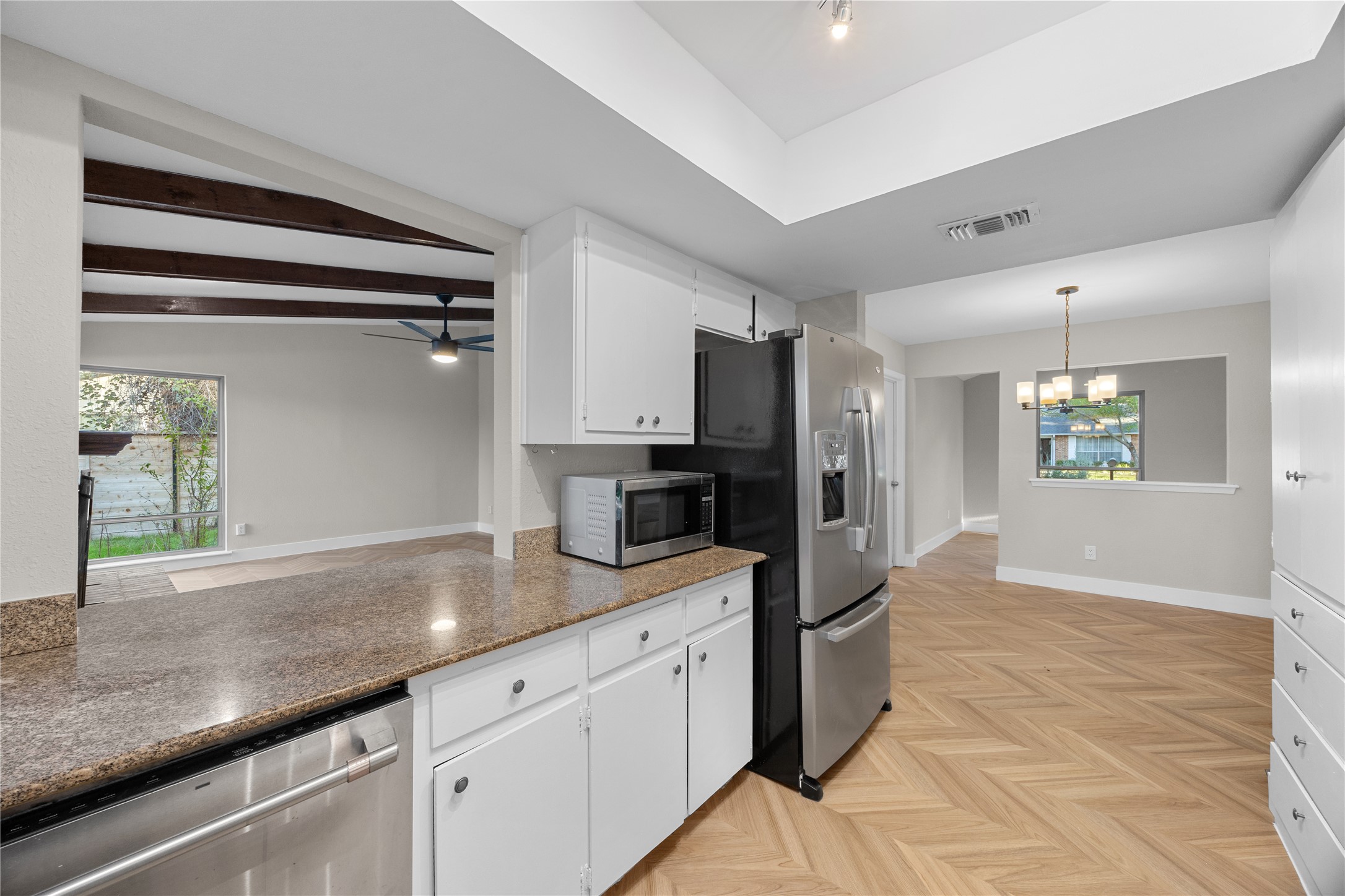 11714 Buckingham Road Austin, TX 78759 - Photo 13 of 34 a kitchen with stainless steel appliances granite countertop a sink and a refrigerator