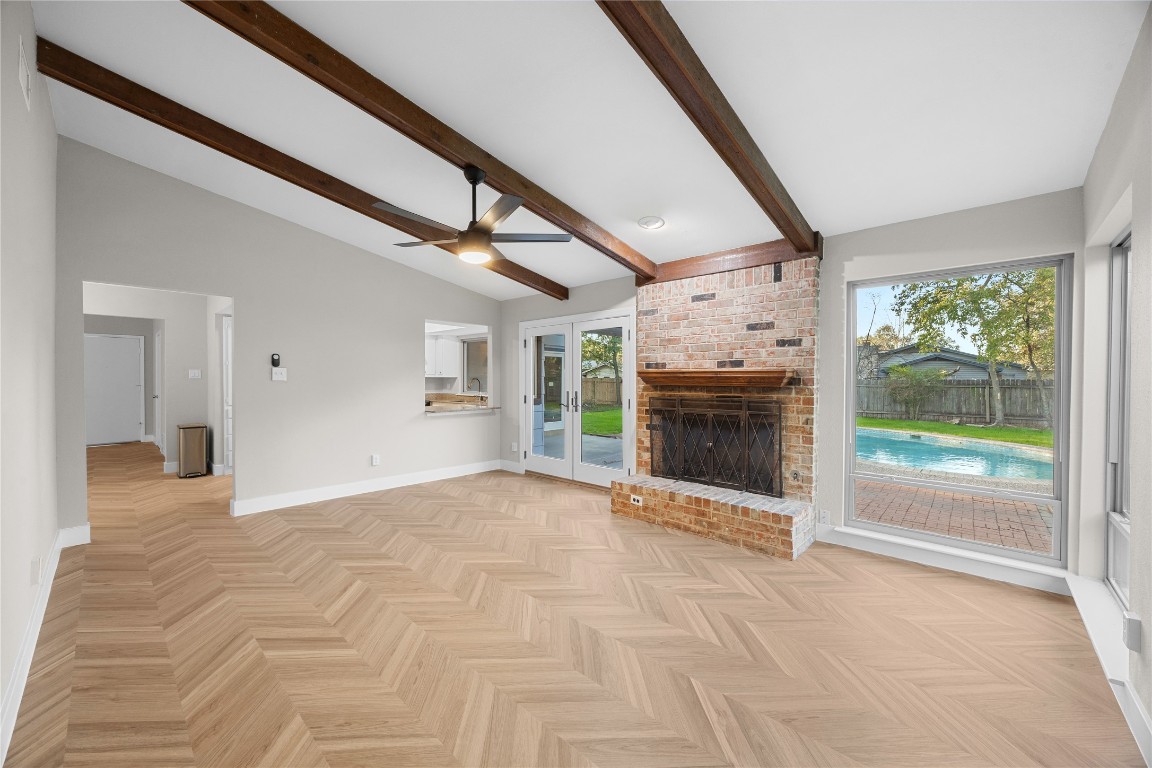 11714 Buckingham Road Austin, TX 78759 - Photo 15 of 35 Great room with a fireplace and a ceiling fan
