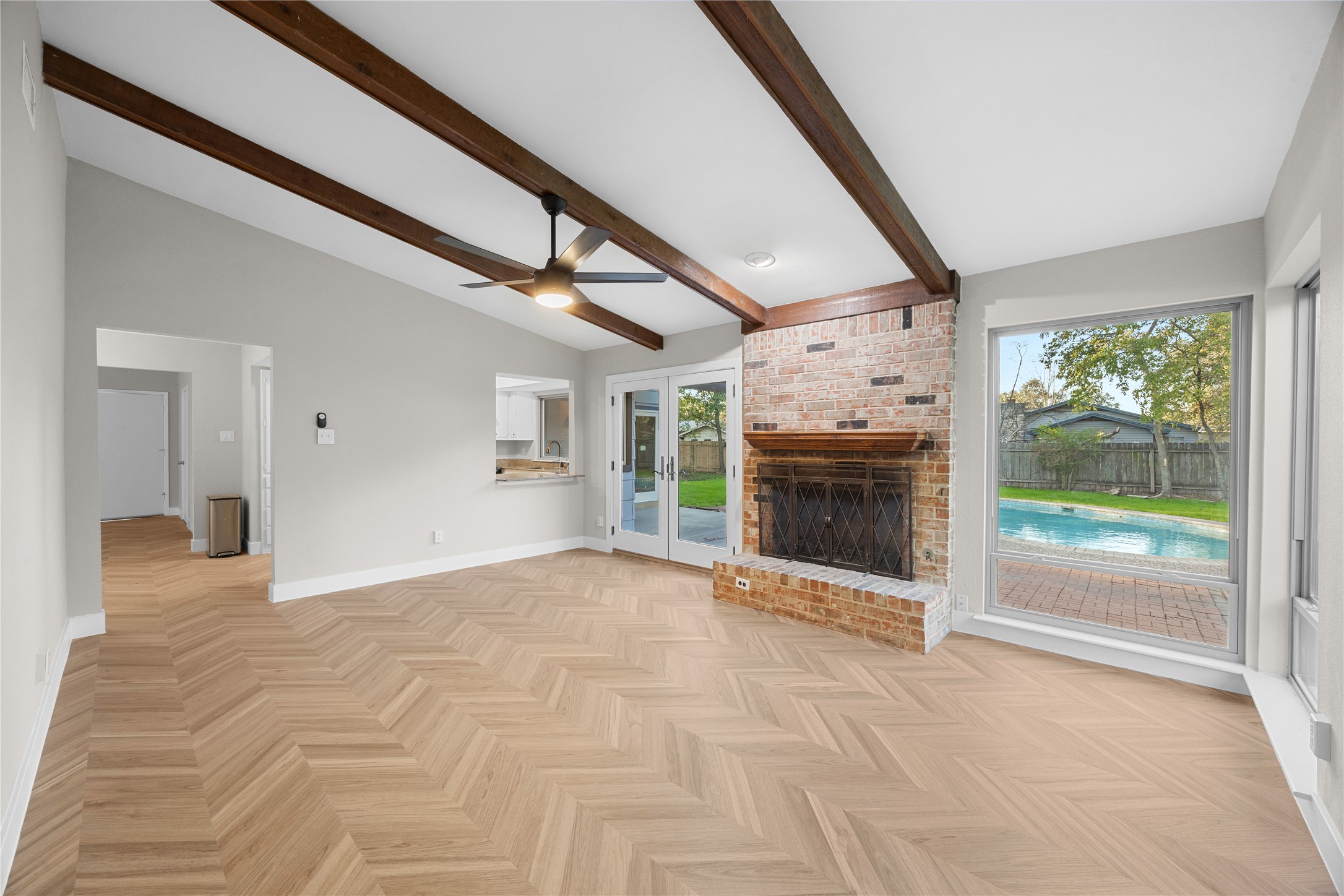 11714 Buckingham Road Austin, TX 78759 - Photo 15 of 34 a view of an empty room with a fireplace and a window