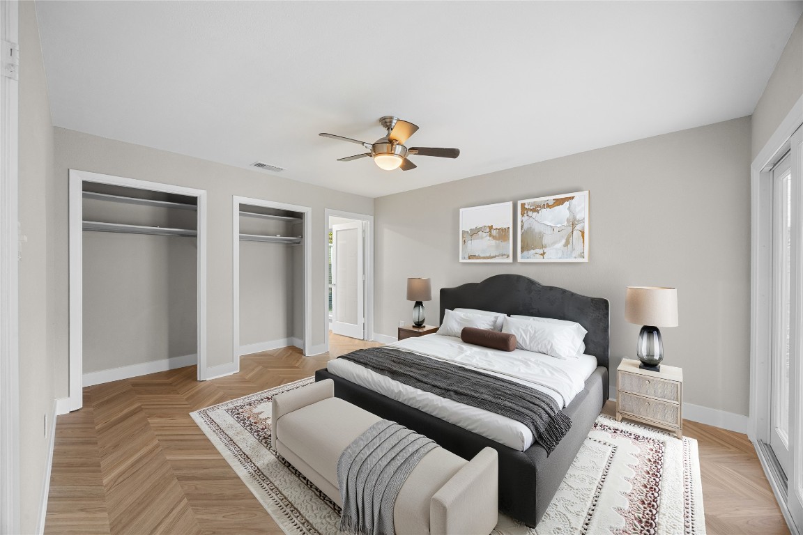 11714 Buckingham Road Austin, TX 78759 - Photo 17 of 35 Primary bedroom with ensuite bath, multiple closets and ceiling fan. Virtually staged.