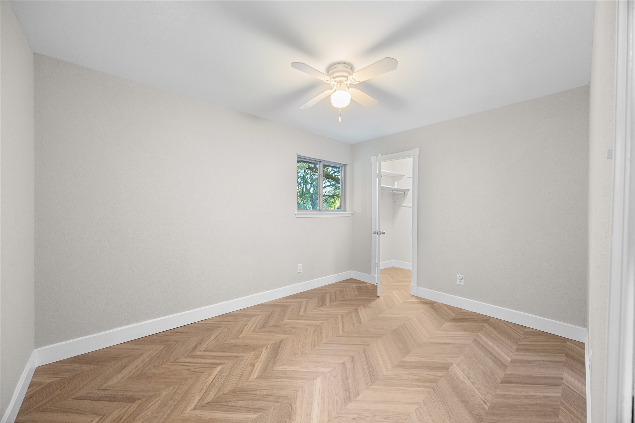 11714 Buckingham Road Austin, TX 78759 - Photo 26 of 34 a view of an empty room with a fan