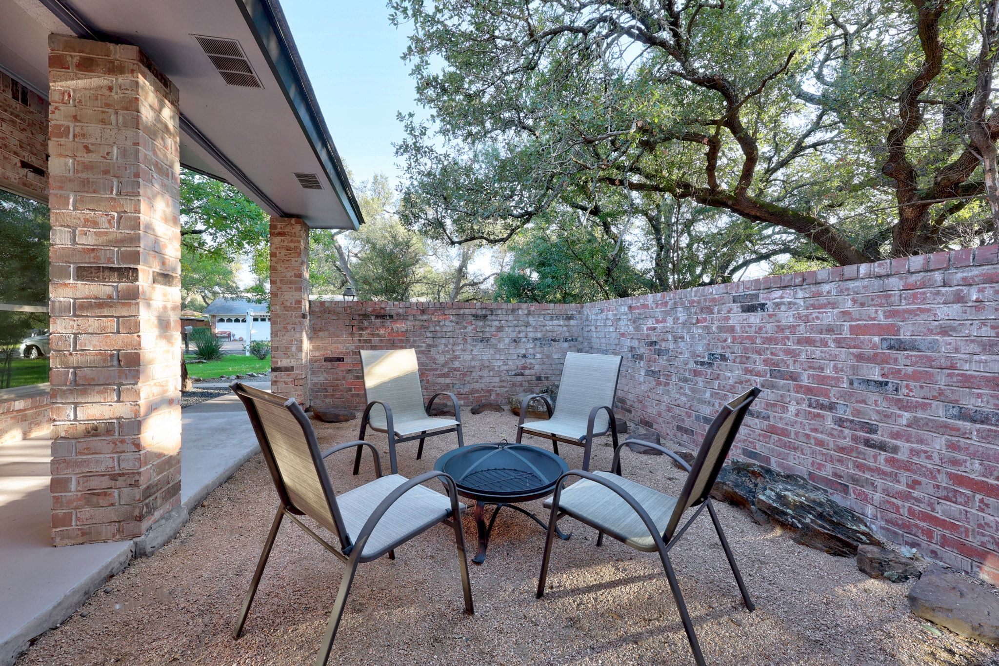 11714 Buckingham Road Austin, TX 78759 - Photo 3 of 34 a view of a chairs and table in the patio
