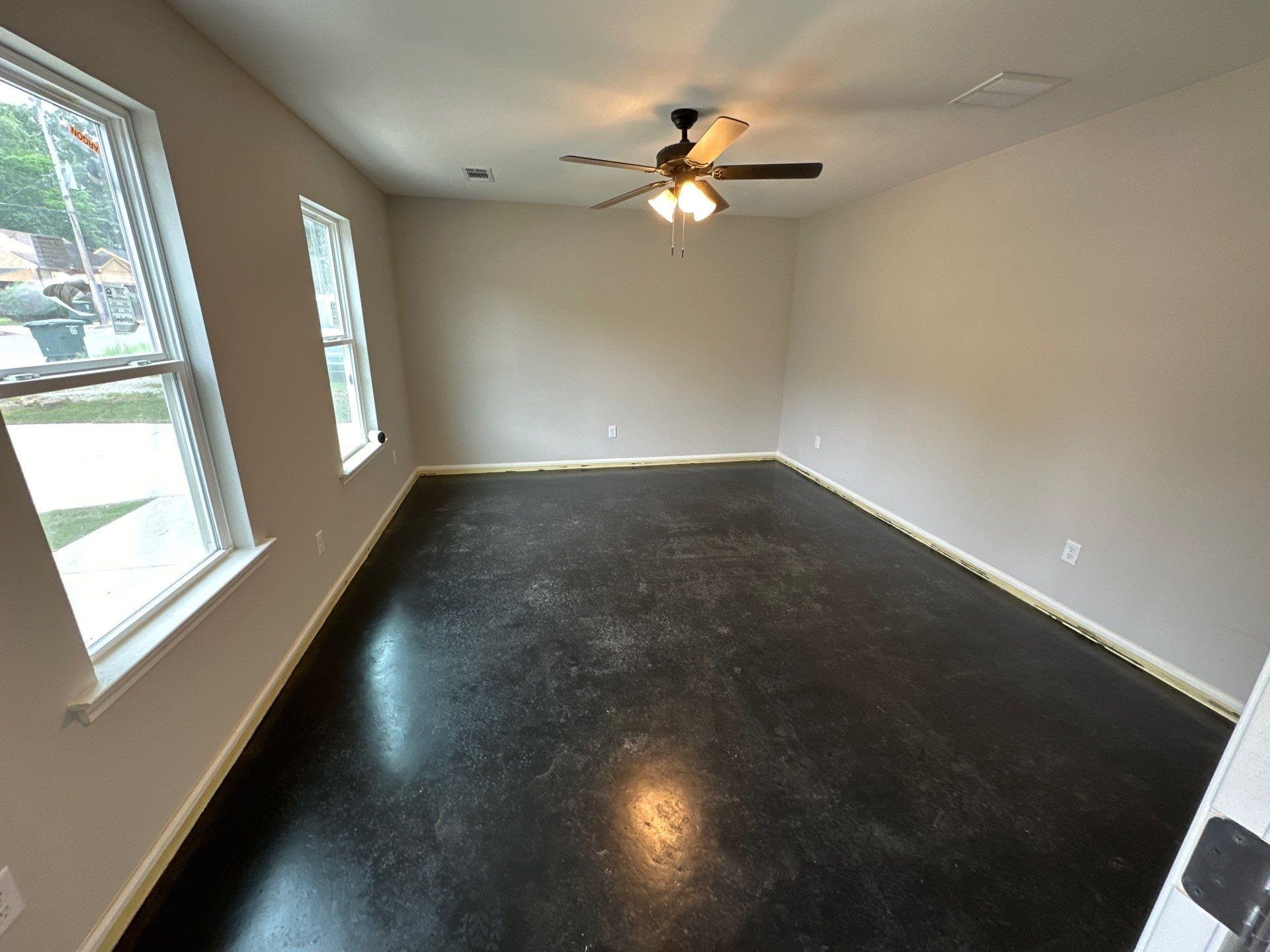 307 Harrell Street Memphis, TN 38112 - Photo 2 of 8 an empty room with windows and fan