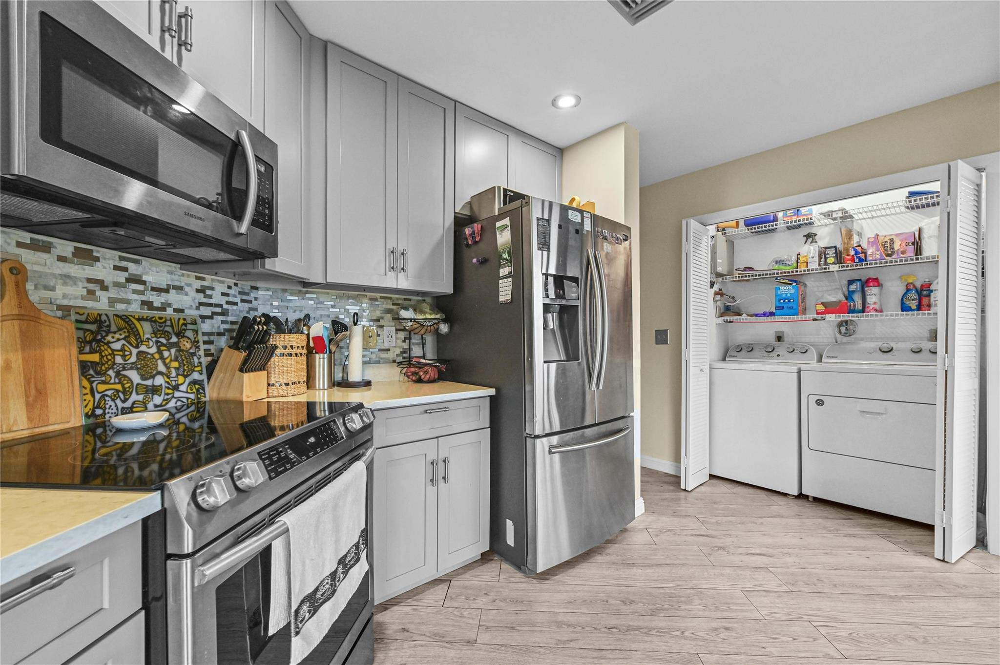 7520 La Paz Boulevard, Unit 306 Boca Raton, FL 33433 - Photo 19 of 36 Laundry in kitchen area