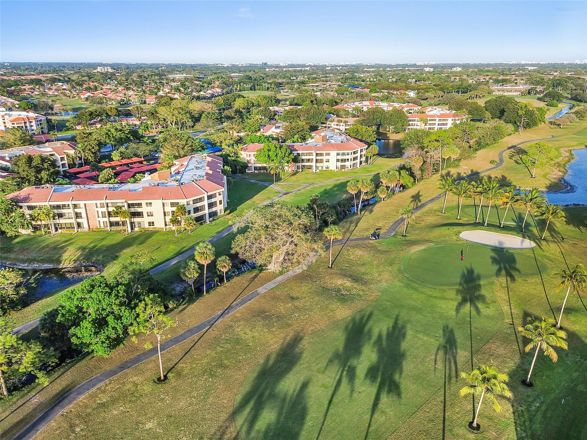 7520 La Paz Boulevard, Unit 306 Boca Raton, FL 33433 - Photo 31 of 36 Golf view from patio