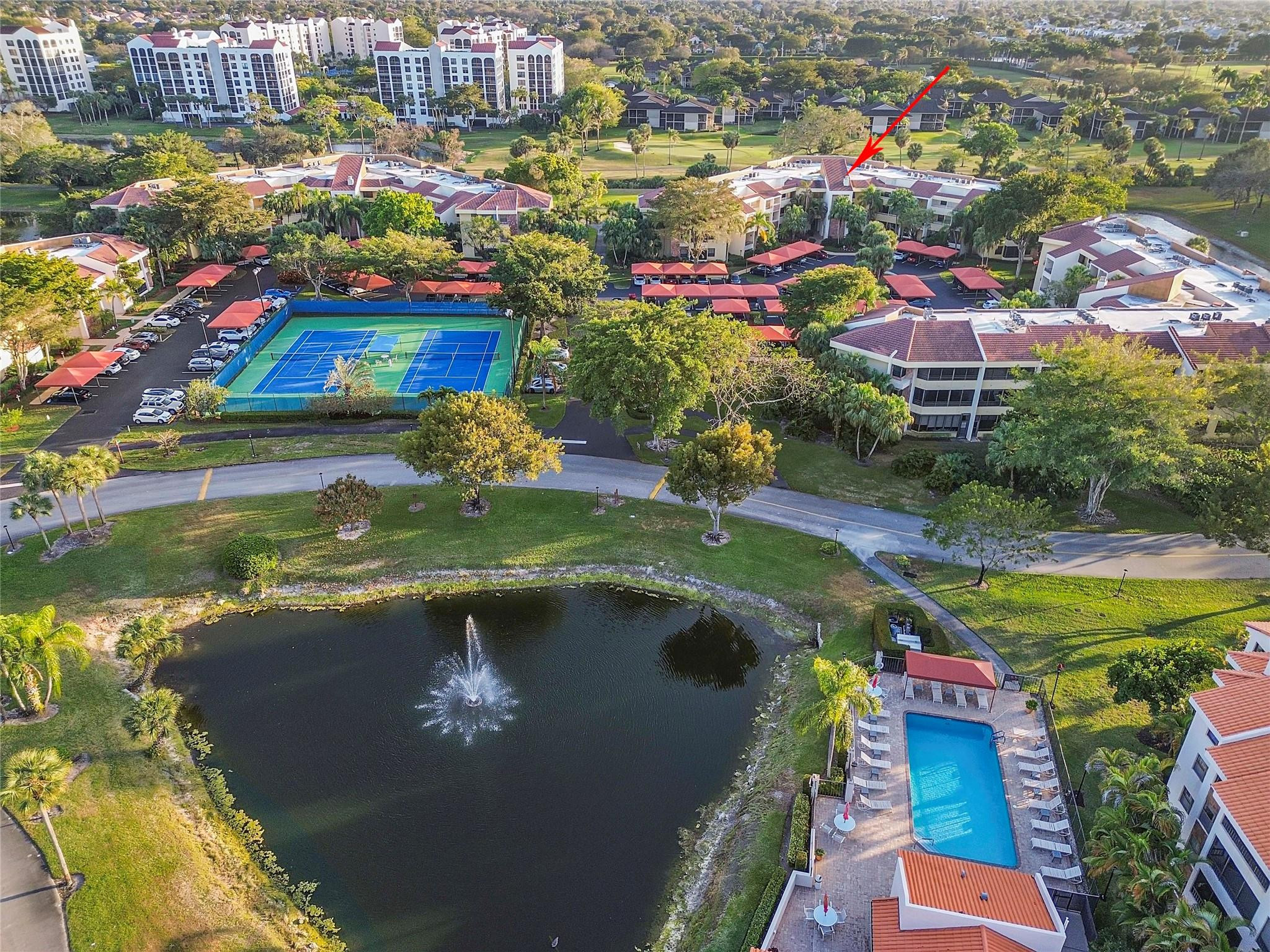 7520 La Paz Boulevard, Unit 306 Boca Raton, FL 33433 - Photo 33 of 36 Community pool adjacent to building