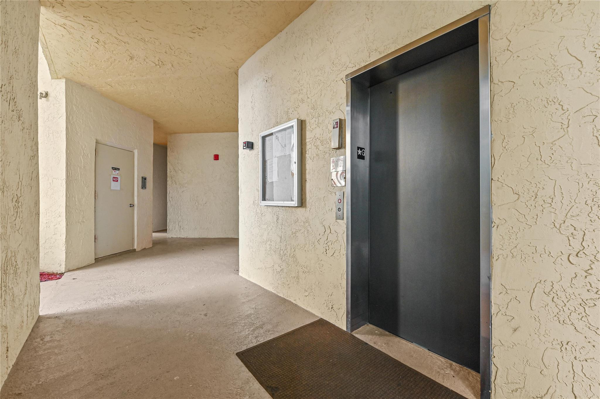 7520 La Paz Boulevard, Unit 306 Boca Raton, FL 33433 - Photo 35 of 36 Elevator and extra storage room