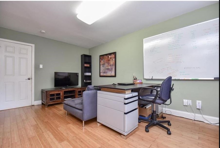 13123 Conifer Road Houston, TX 77079 - Photo 15 of 31 Home office originally was bedroom with two closets and beautiful wood flooring.