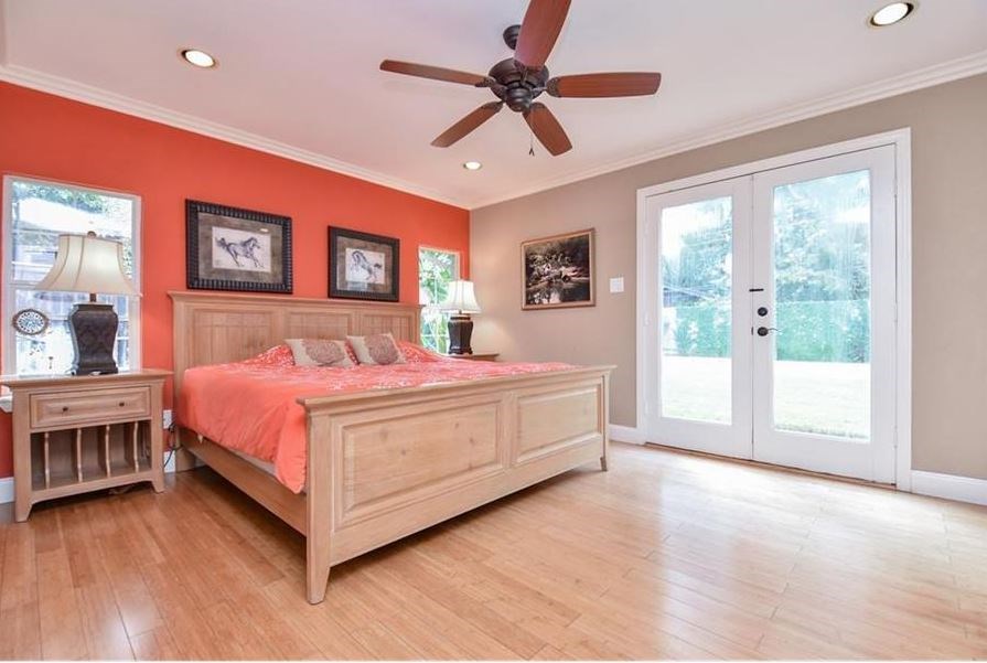 13123 Conifer Road Houston, TX 77079 - Photo 19 of 31 View of the Primary Bedroom with french doors leading to backyard with Pool