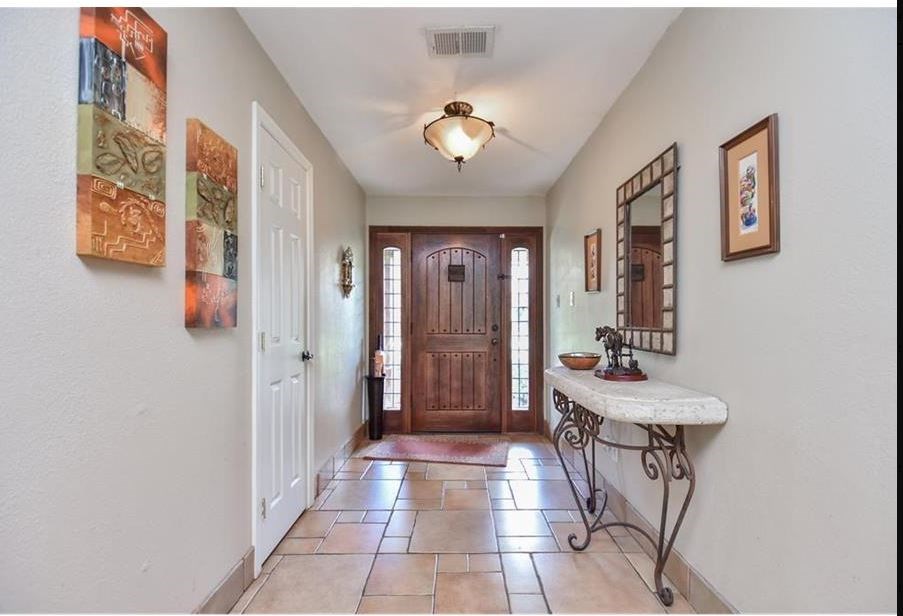 13123 Conifer Road Houston, TX 77079 - Photo 31 of 31 Inviting entryway to open floorplan home with tile flooring.