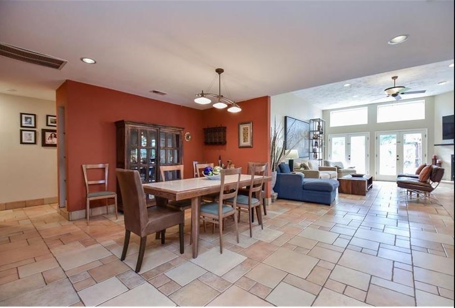 13123 Conifer Road Houston, TX 77079 - Photo 5 of 31 View of the Dinning room leading to Living Room with natural light and view of backyard with pool