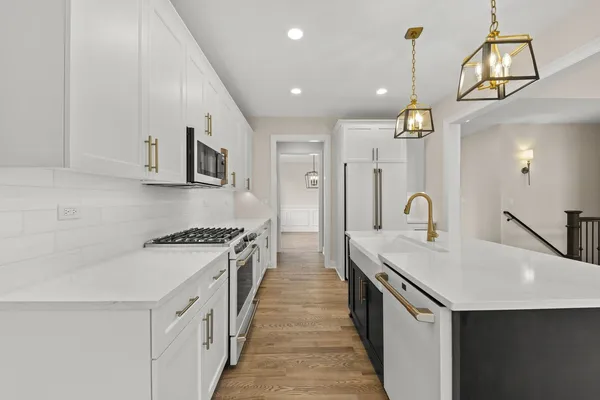 a kitchen with a stove and a sink