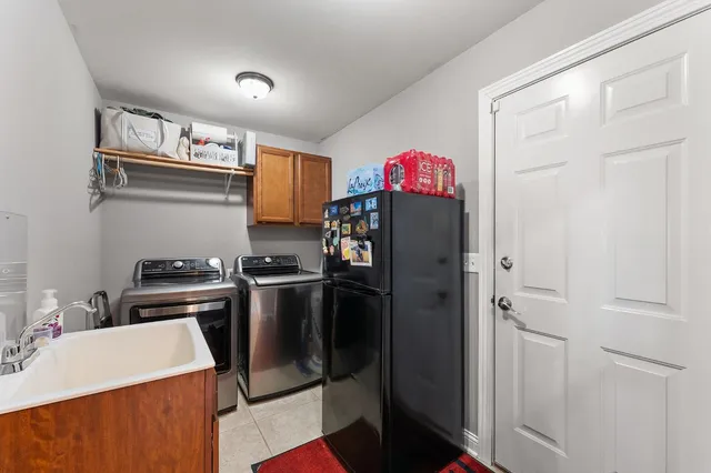 a kitchen that has a refrigerator and a stove