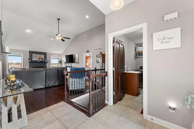 a view of a livingroom with furniture and windows
