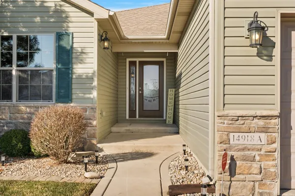 a front view of a house with outdoor seating