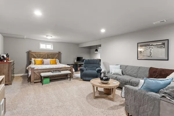 a bedroom with furniture and a couch