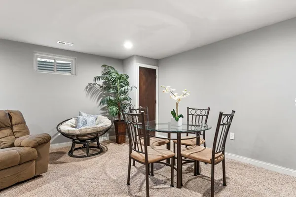 a view of a livingroom with furniture and a chair