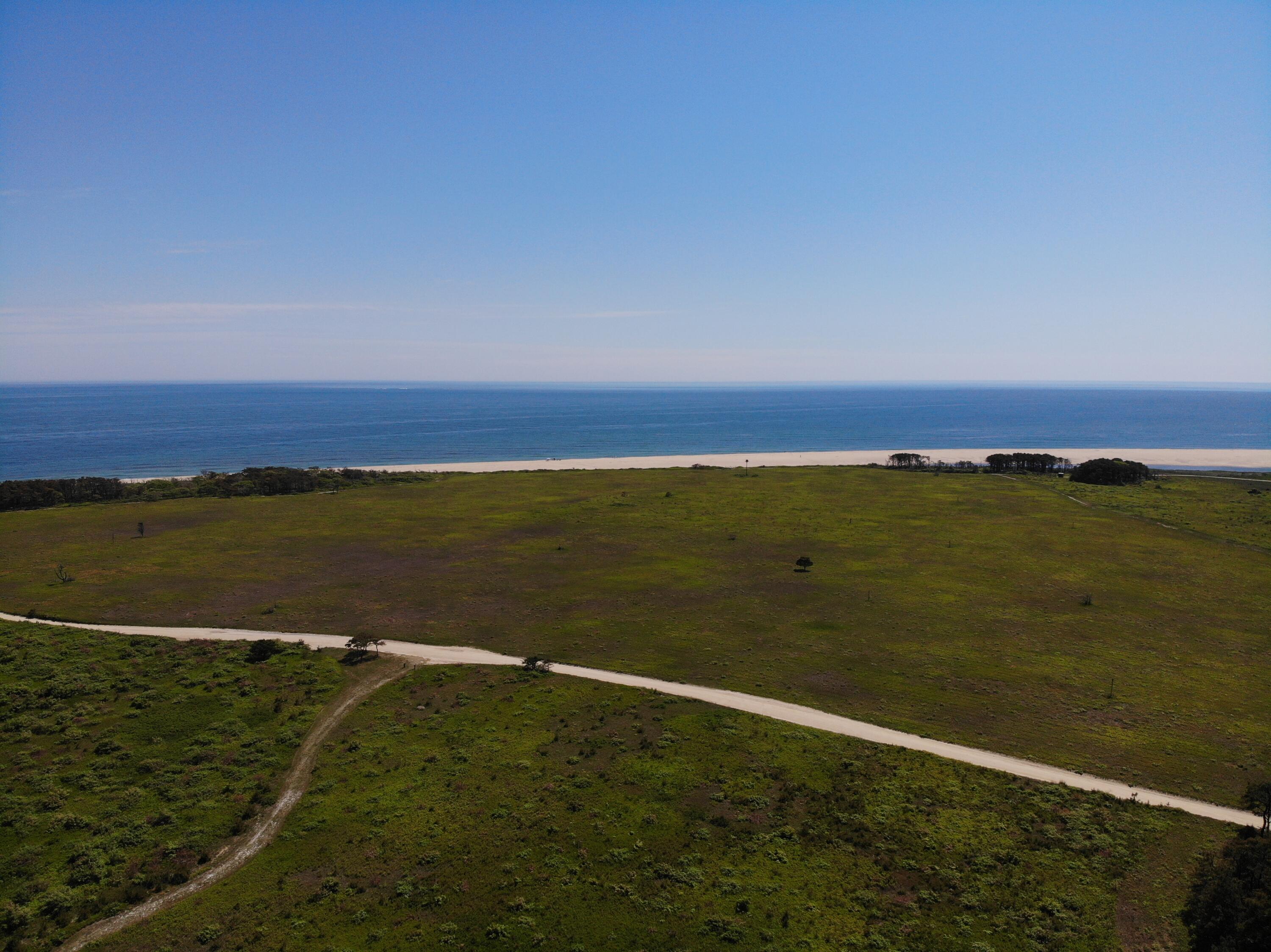 0 Pocha Road Extension Edgartown, MA 02539 - Photo 8 of 8 a view of an ocean from a yard