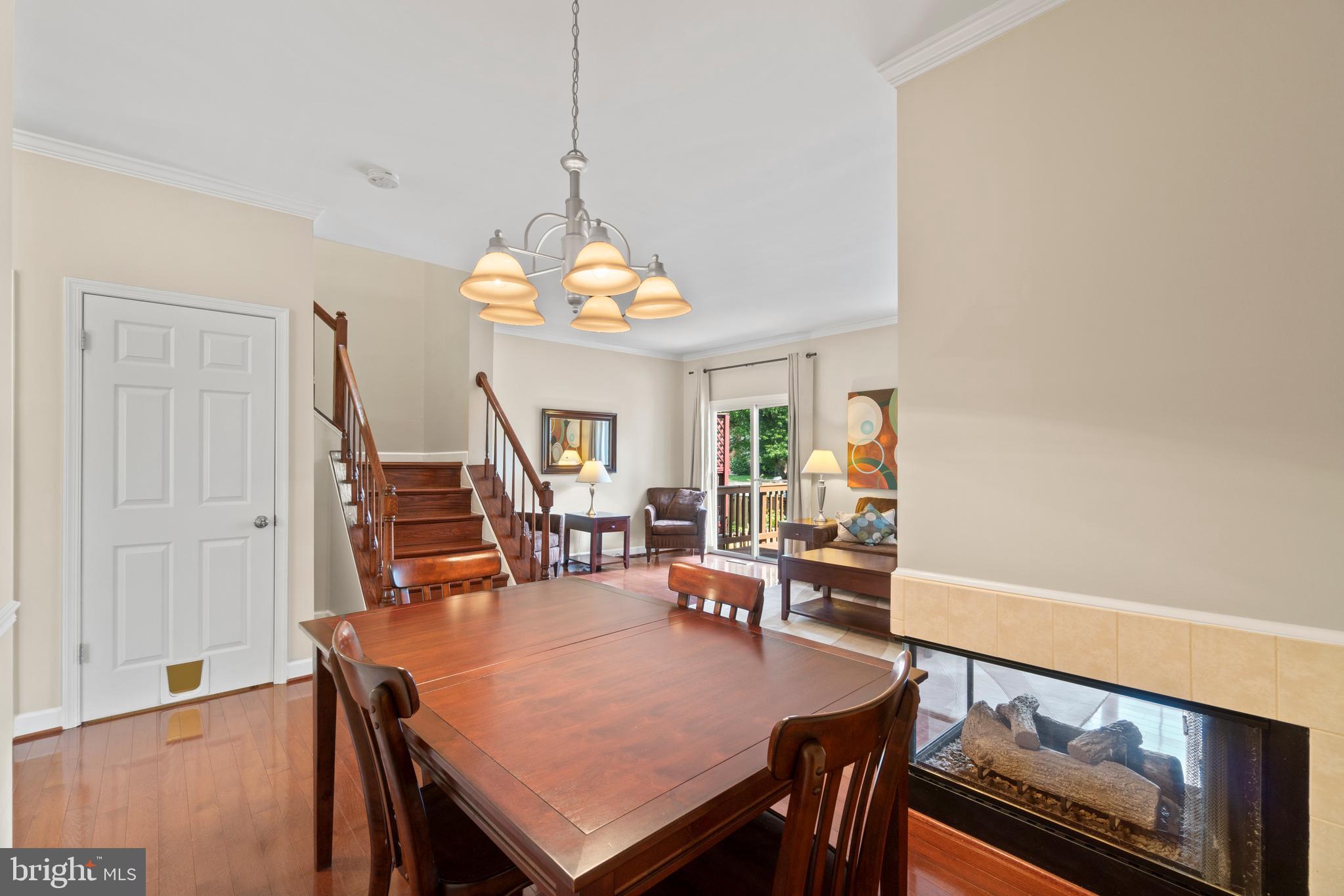 47572 Comer Square Sterling, VA 20165 - Photo 5 of 40 Spacious dining room sides to 3-sided gas fireplac